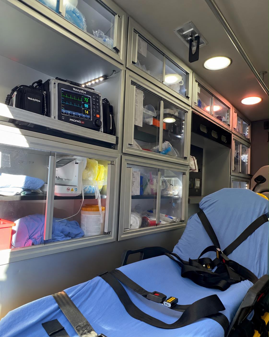 Interior of the United EMS ambulance with a stretcher and medical supplies