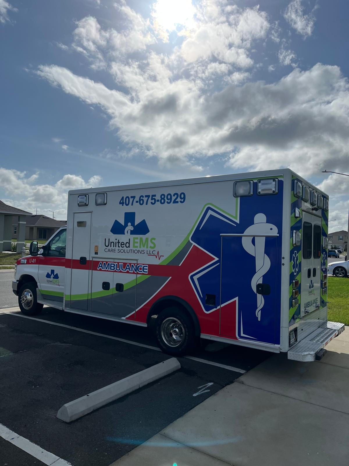 United EMS Care Solutions ambulance showing the company branding and phone number